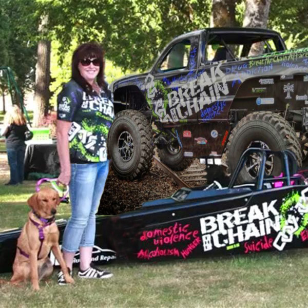 Tammi beside the Break the Chain race truck